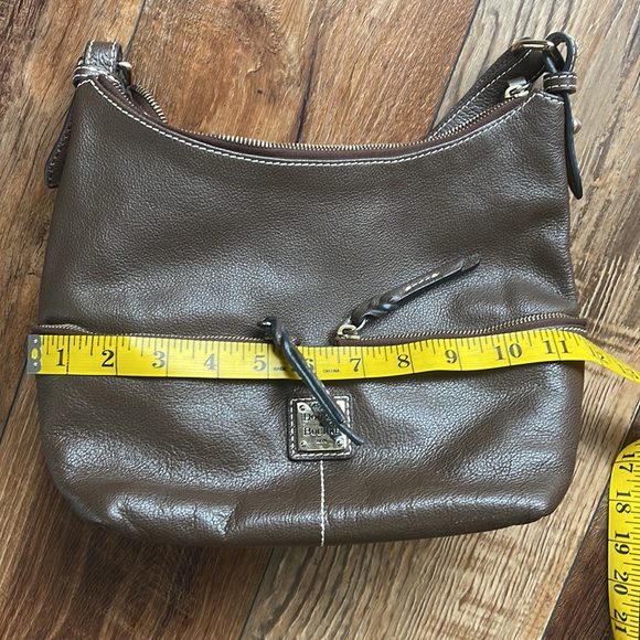 Dooney and Bourke. Brown leather shoulder bag. Has interior stains. - Picture 12 of 14